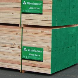 Image showing Green Studs lumber stacked.